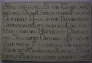 a marble sign hanging in the YWCA